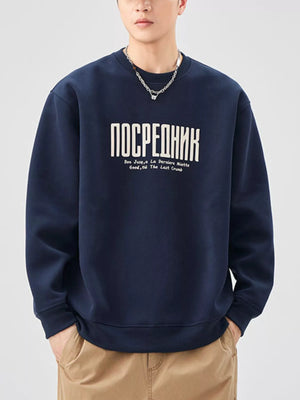 Navy blue oversized sweatshirt with white graphic text and crew neck.