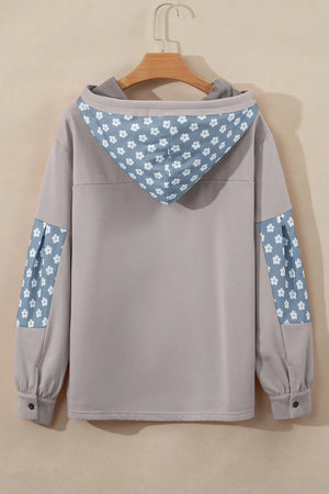 Tan floral patchwork hoodie with a hood and button cuffs.