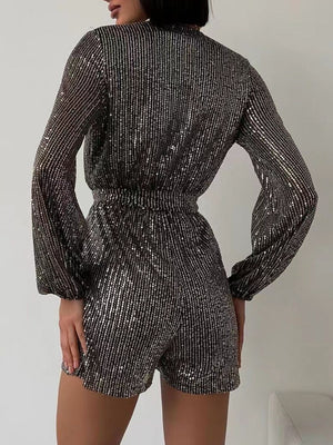 Black/Silver sequin romper with blouson sleeves and wrap detail.