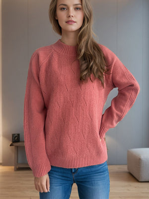 Textured knit raglan sleeve pullover in burnt coral with mock neck and diamond pattern.