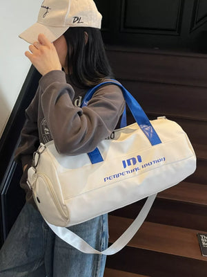 Off-white sporty duffel bag with blue graphic text and blue handles, adjustable strap.