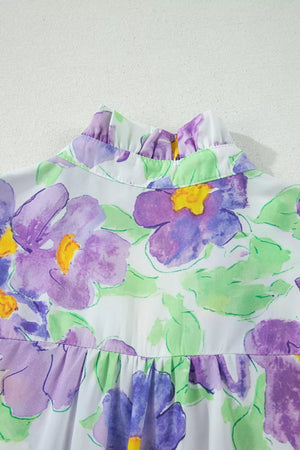 Mini dress with vibrant floral print, ruffled high neck, and tiered detail.