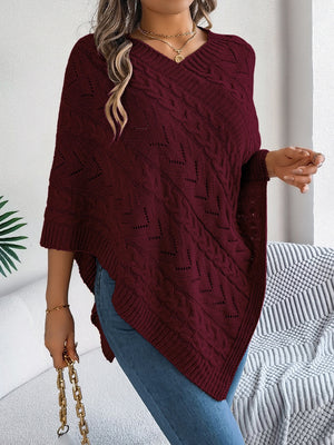 Burgundy cable knit poncho with chevron detail and v-neck.