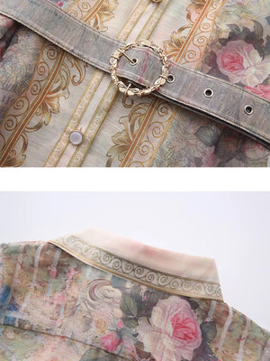 Belted shirt dress with pastel floral print, ornate buckle detail, and button front.