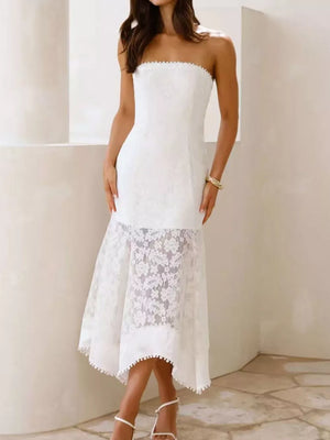 White strapless midi dress with floral lace overlay and pom-pom trim hem.