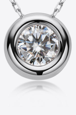Silver bezel-set moissanite solitaire necklace with a round-cut stone.