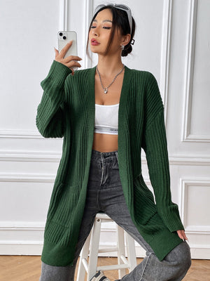 Ribbed knit pocket cardigan in Black Forest green acrylic with long sleeves and an open front.