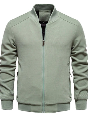Sage green textured knit bomber jacket with faux shearling lining and zip closure.