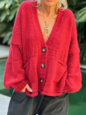 Deep Red bouclé oversized button-down cardigan with pockets and balloon sleeves.
