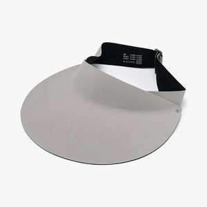 Sculptural visor sun shield in light gray with adjustable black band.