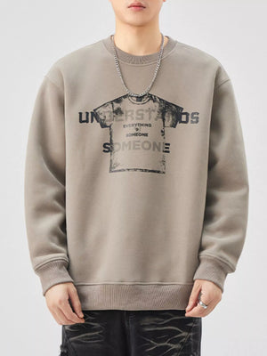 Men's oversized khaki graphic sweatshirt with crewneck and distressed print.