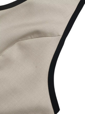 Beige halter neck romper with black contrast trim detail