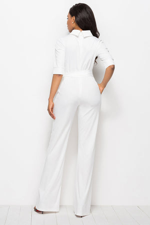 White high-neck belted palazzo jumpsuit with half sleeves and wide legs.