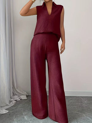 Burgundy sleeveless collared top and wide-leg pants set with textured fabric.