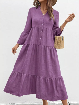 Purple tiered ruffle hem v-neck dress with button front and bell sleeves.
