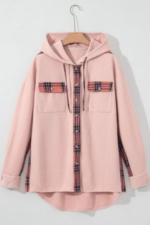 Blush pink waffle knit shacket with plaid trim on pockets and button placket, featuring a hood.
