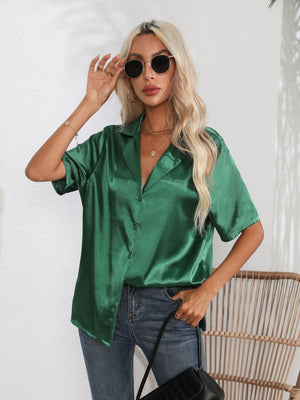 Emerald green satin collared button-up shirt with short sleeves.