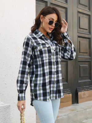 Black plaid overshirt with flap pockets and buttoned front, styled casually.