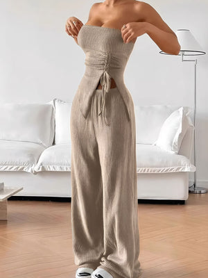 Ribbed knit tube top with drawstring detail and wide leg pants in beige.