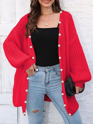 Red balloon sleeve cardigan with pearl buttons, open knit detail.