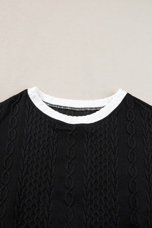 Black textured knit loungewear top with contrast white trim neckline