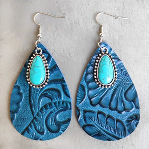 Aqua tooled leather teardrop earrings with turquoise stone accents and silver hooks.