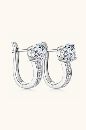 Silver pavé and solitaire hoop earrings with a single large stone and a row of smaller stones.