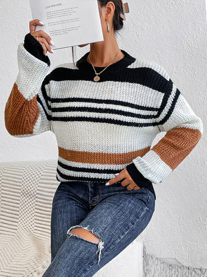 Colorblock stripe knit crewneck sweater in caramel, black, and white acrylic with a relaxed fit.