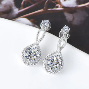 Infinity drop earrings with clear stones and silver setting.