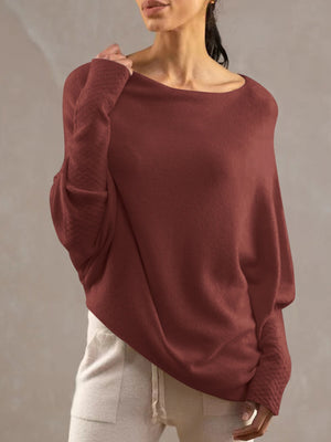 Burgundy off-shoulder knit sweater with textured cuffs and batwing sleeves.