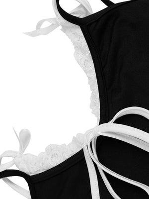 Black capri romper with white lace trim and tie straps.