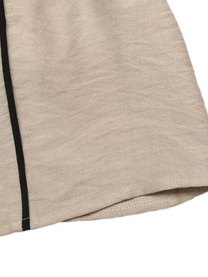 Elegant tied maxi dress in beige linen blend with black piping detail on the side.