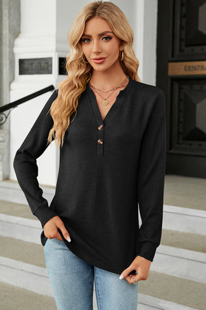 Black waffle knit henley shirt with button placket and long sleeves