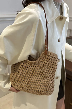 Camel crochet weave shoulder bag with leather strap detail.