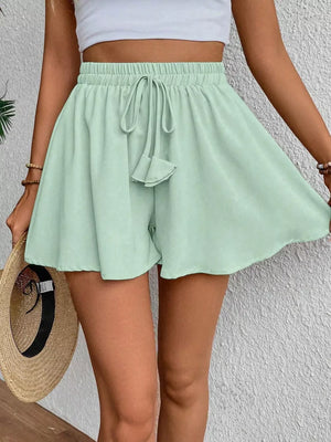 Light green cotton chino shorts with drawstring waist and a-line cut