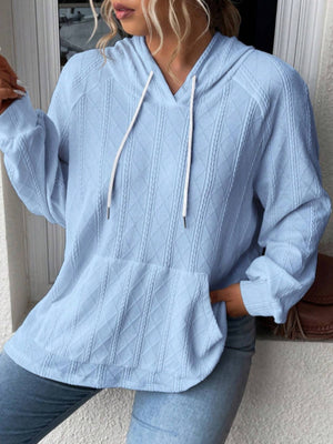 Light blue textured knit raglan hoodie with white drawstrings and a front pocket.