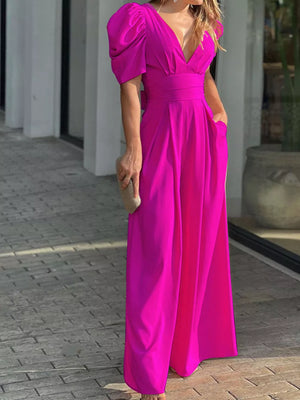 Hot Pink Puff Sleeve Romper with deep V-neck and cinched waist.