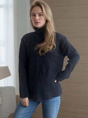 Black ribbed hemline slit-side turtleneck knit sweater with long sleeves.