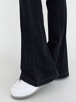 Crossover waist flare jeans in dark wash denim with a subtle flare and contrast stitching.