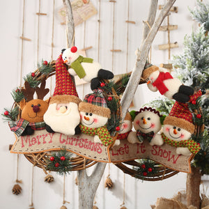 Festive wreath with plush Santa, reindeer, and snowmen figures, "Merry Christmas" banner.