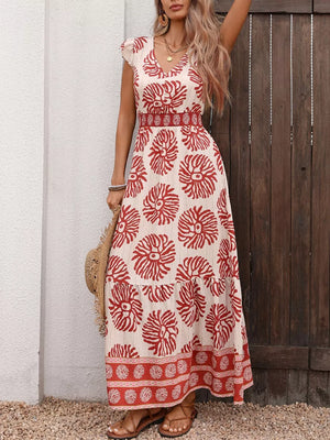 Floral V-neck maxi dress with smocked waist and ruffled sleeves, red floral print on cream.