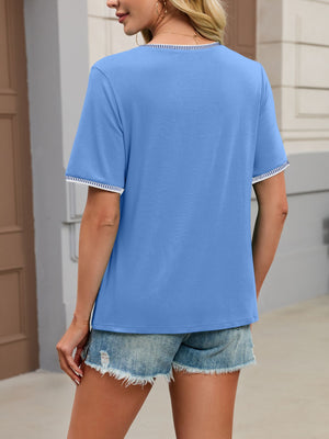 Blue t-shirt with contrast trim on neckline and sleeves.