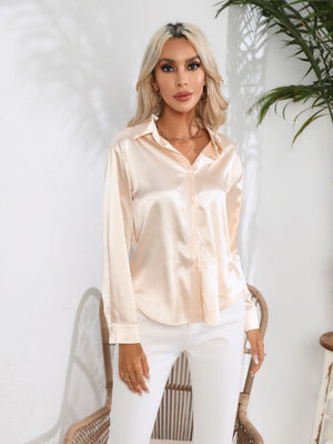 Blush pink satin tie-front blouse with buttoned front and collared neckline.