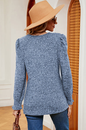 Light blue ribbed tee with square neck, puff sleeves, and ruffled cuffs.