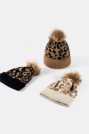 Textured leopard print acrylic beanies with faux fur pom in Khaki, Beige, and Black.