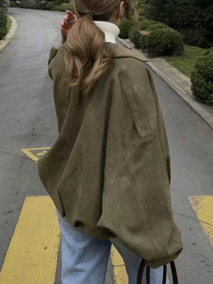 Oversized military green zip-up jacket with a relaxed fit and dropped shoulders.