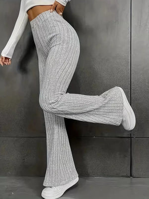 Ribbed high-waist flare maternity pants in light grey, showing the flared leg detail.