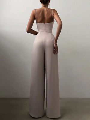 Ruched spaghetti strap wide-leg jumpsuit in Lotus Root, with a fitted bodice and flowing pants.