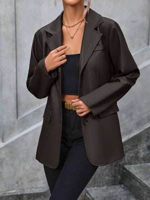 Brown faux leather tailored blazer with buttoned front and flap pockets.