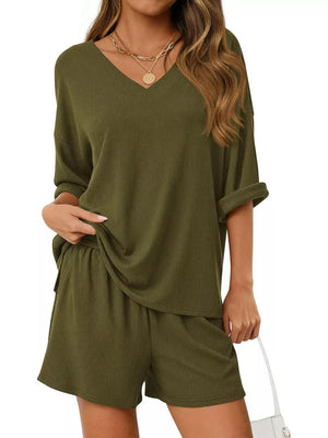 Sage green ribbed V-neck lounge set with cuffed short sleeves and drawstring shorts.